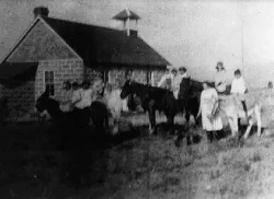 Historic photo of children and horse at Maxwell Schoolhouse. Courtesy of Suzy Kelly.